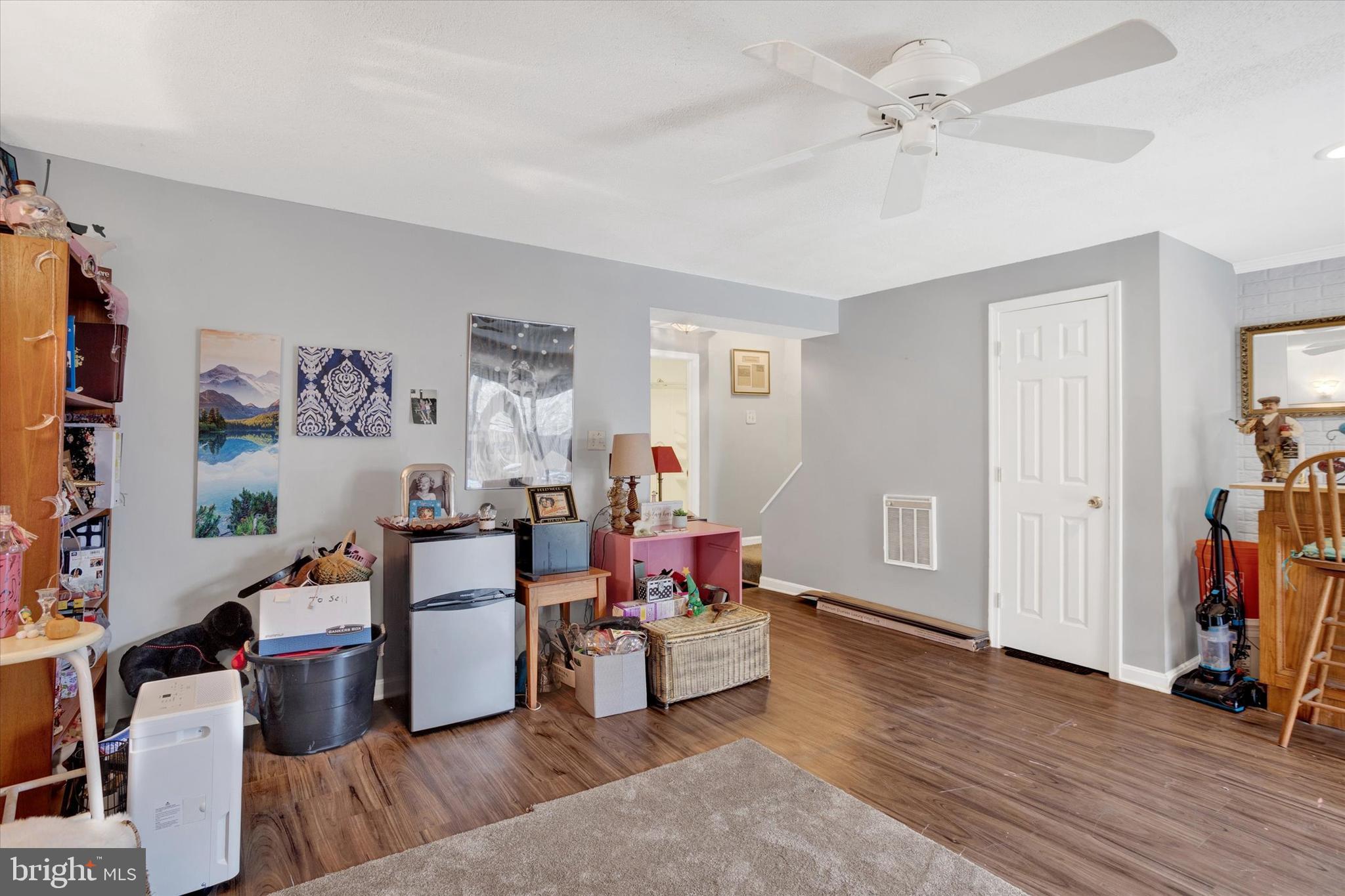 7278 Procopio Circle Columbia, MD 21046 - Photo 23 of 30 a living room with furniture and a wooden floor