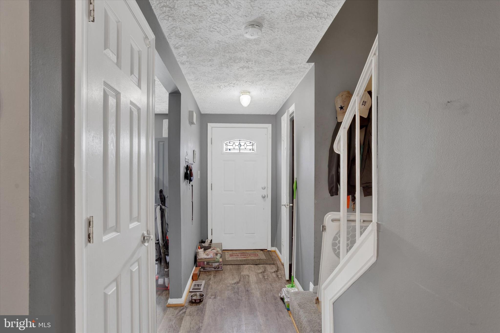 7278 Procopio Circle Columbia, MD 21046 - Photo 3 of 30 a view of a hallway with wooden floor and staircase