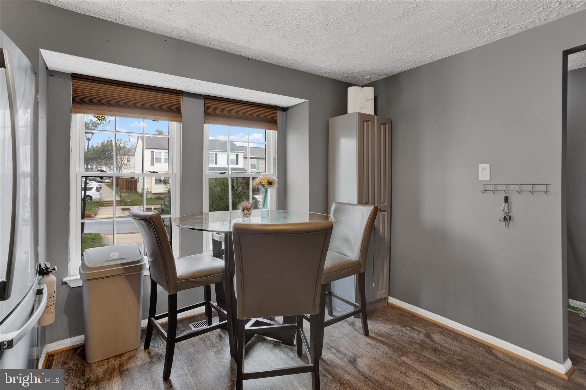 7278 Procopio Circle Columbia, MD 21046 - Photo 7 of 30 a view of a dining room with furniture and window