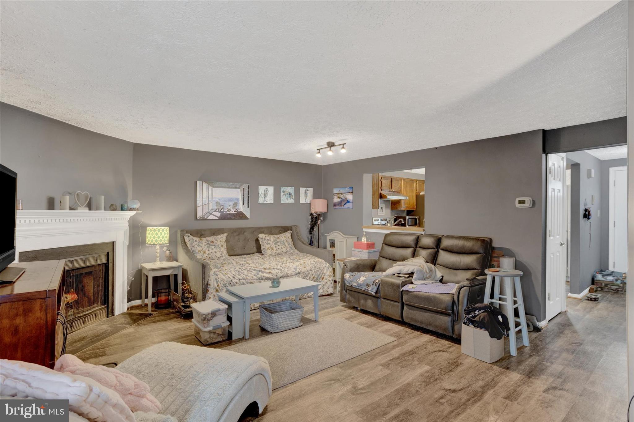 7278 Procopio Circle Columbia, MD 21046 - Photo 9 of 30 a bedroom with furniture and a fireplace