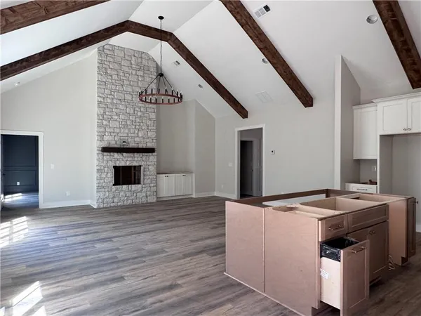 a view of kitchen with sink and microwave