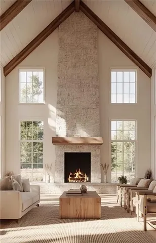 a kitchen with stainless steel appliances kitchen island granite countertop a table chairs and a refrigerator