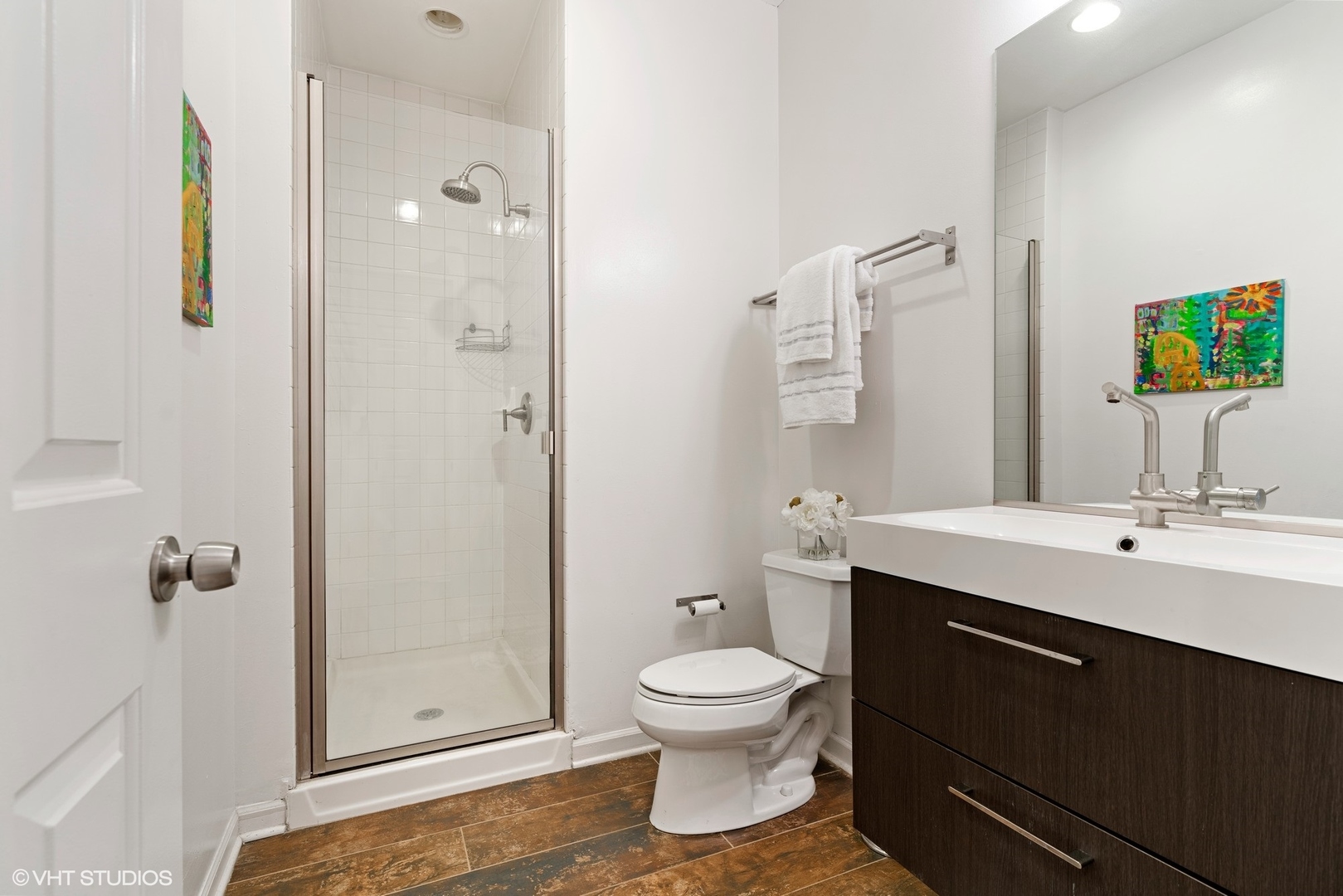 931 West Wolfram Street, Unit 2 Chicago, IL 60657 - Photo 12 of 13 a bathroom with a toilet sink and shower
