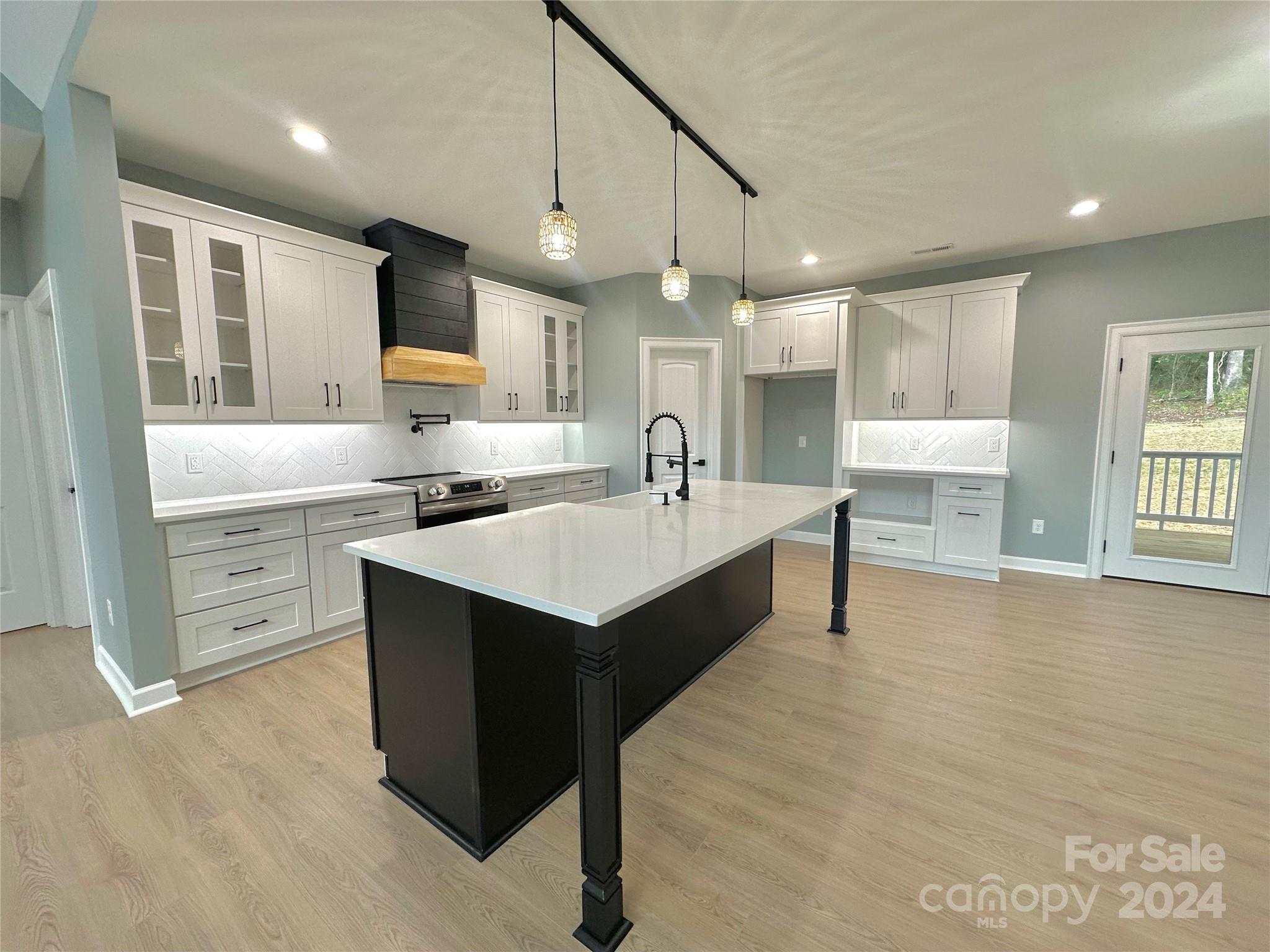 169 Harbor Point Drive Cherryville, NC 28021 - Photo 13 of 37 a large white kitchen with a large window