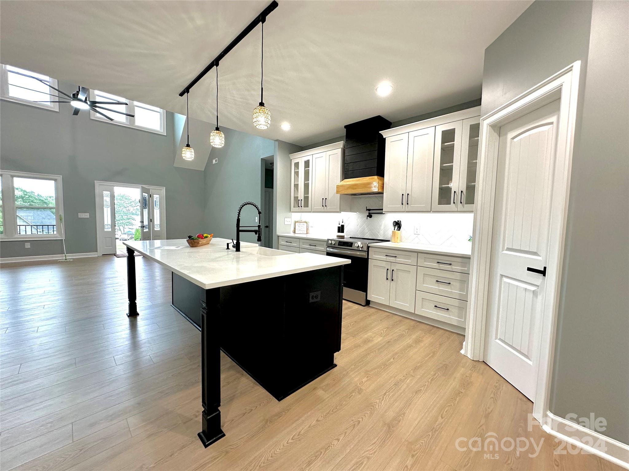169 Harbor Point Drive Cherryville, NC 28021 - Photo 14 of 37 a kitchen with a sink cabinets and wooden floor