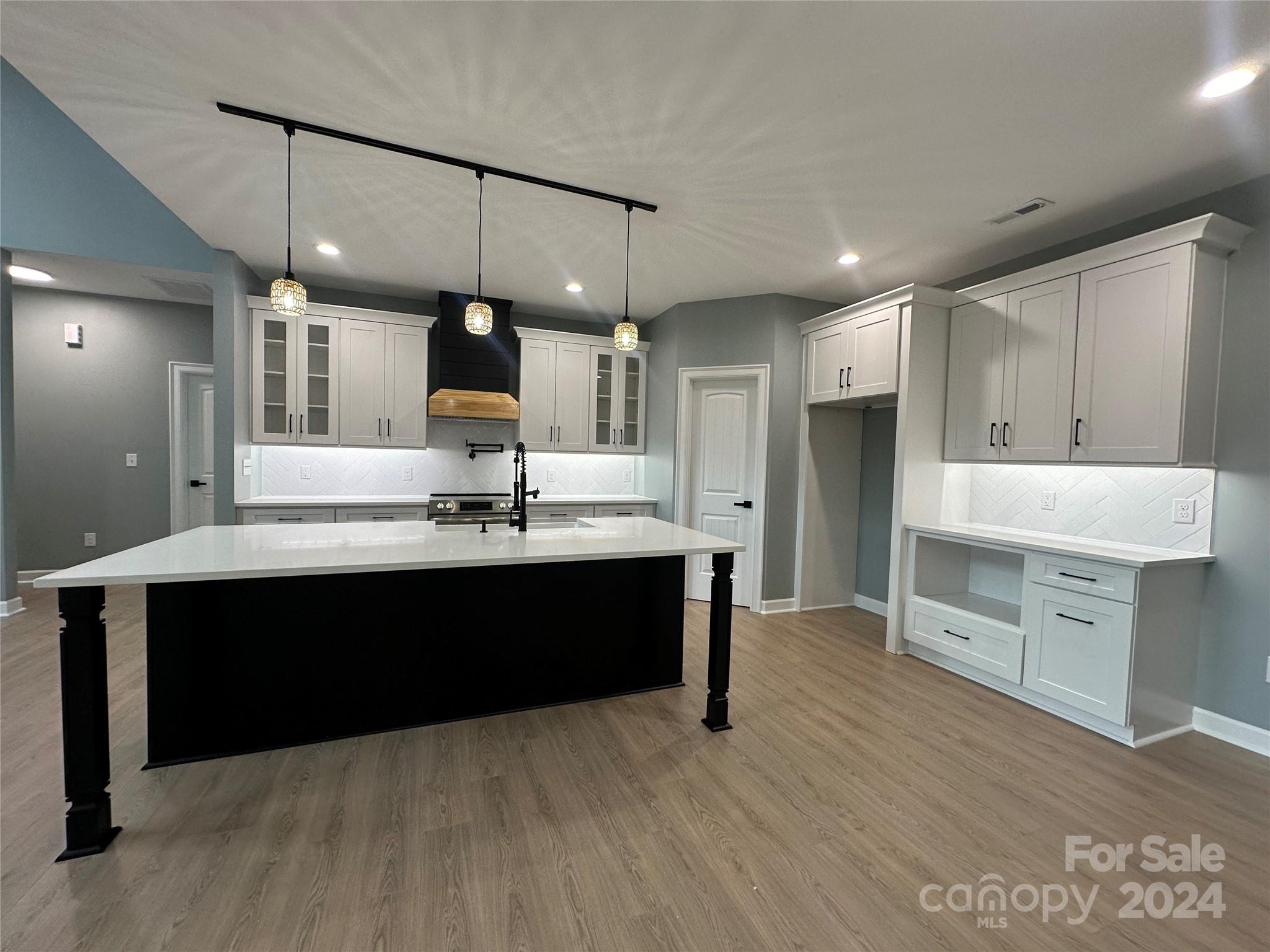 169 Harbor Point Drive Cherryville, NC 28021 - Photo 17 of 37 a kitchen with a sink and a stove top oven