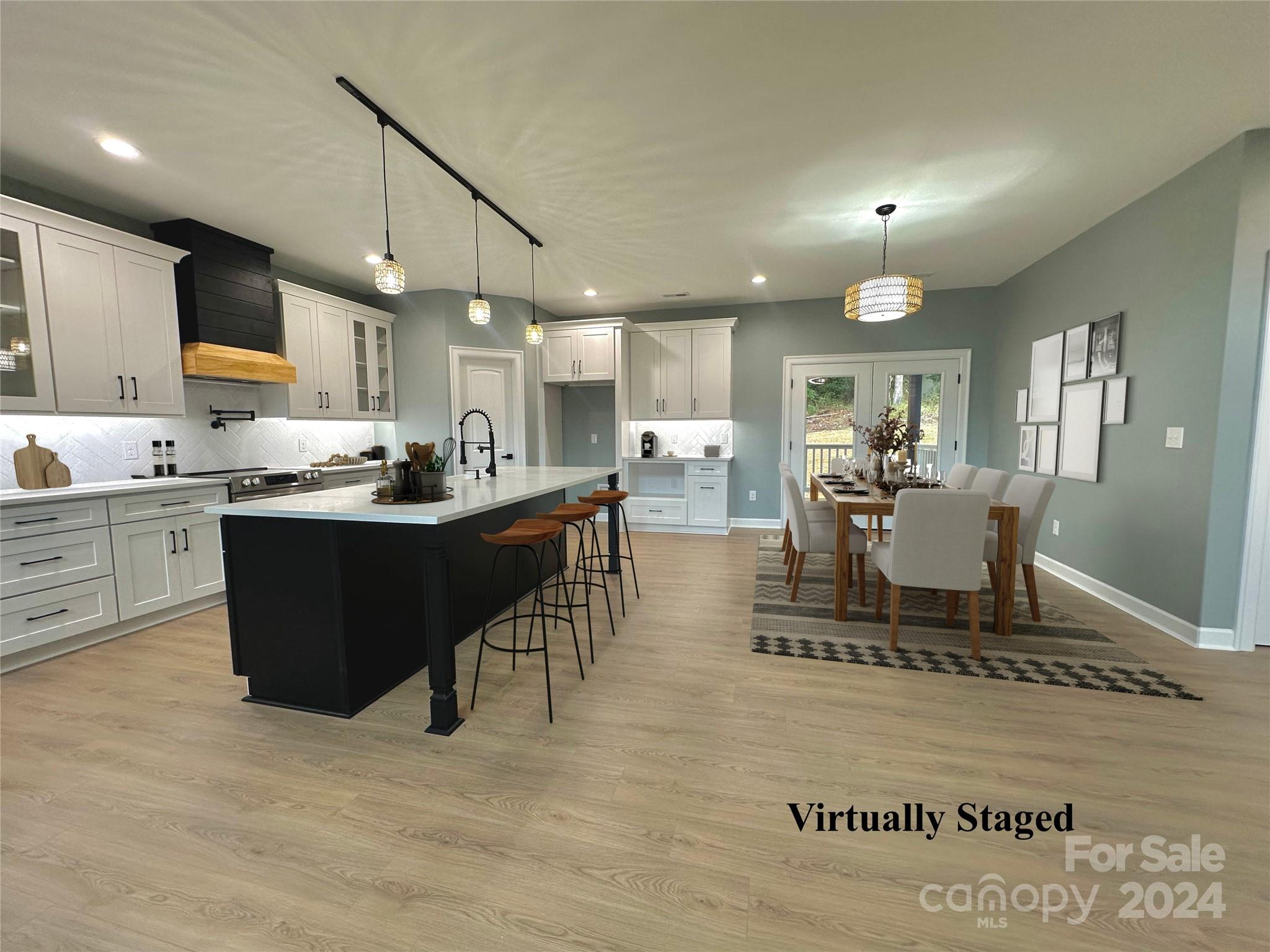 169 Harbor Point Drive Cherryville, NC 28021 - Photo 18 of 37 a dining hall with stainless steel appliances kitchen island granite countertop a table chairs and a sink