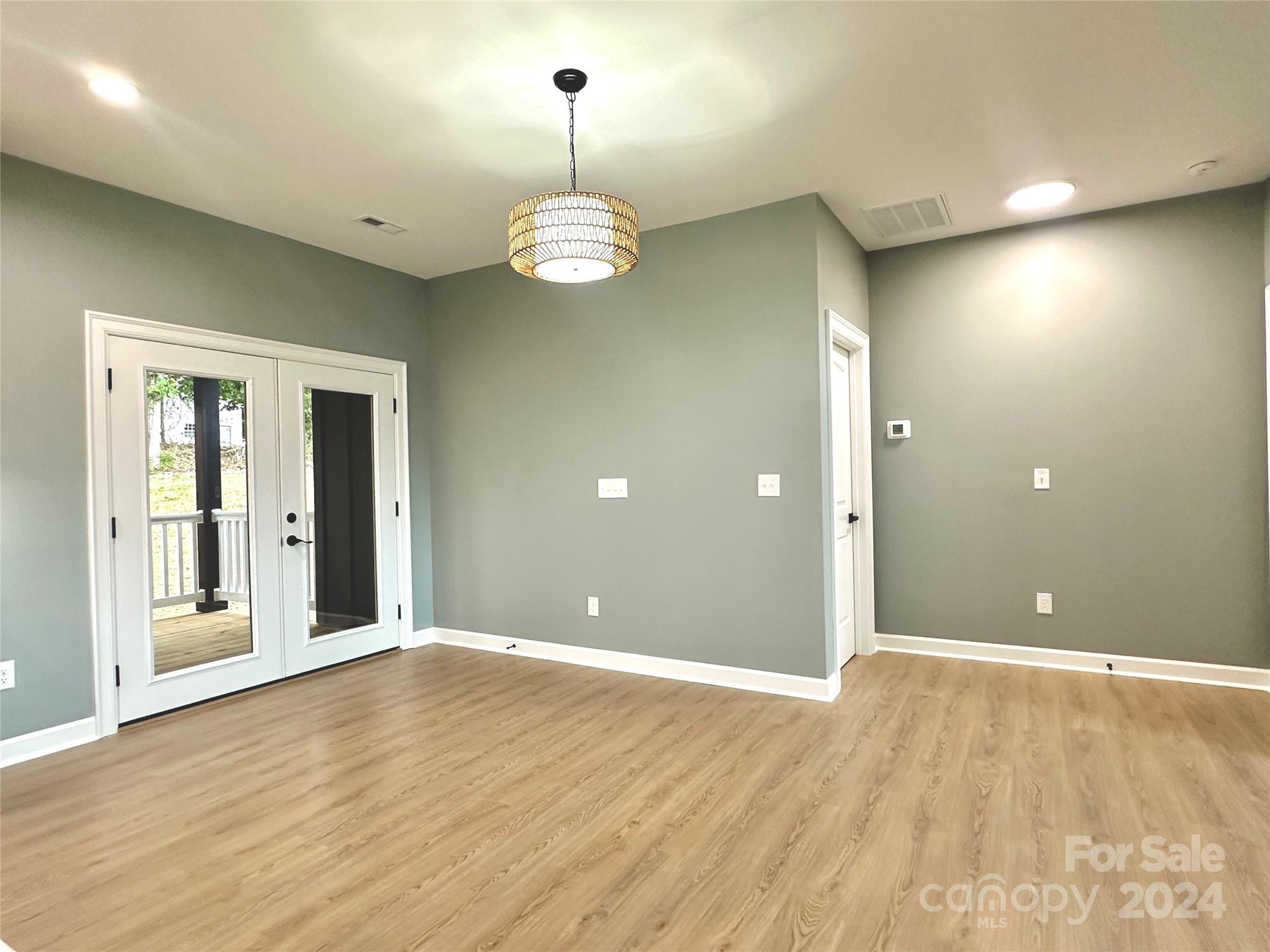 169 Harbor Point Drive Cherryville, NC 28021 - Photo 19 of 37 a view of empty room with wooden floor and window