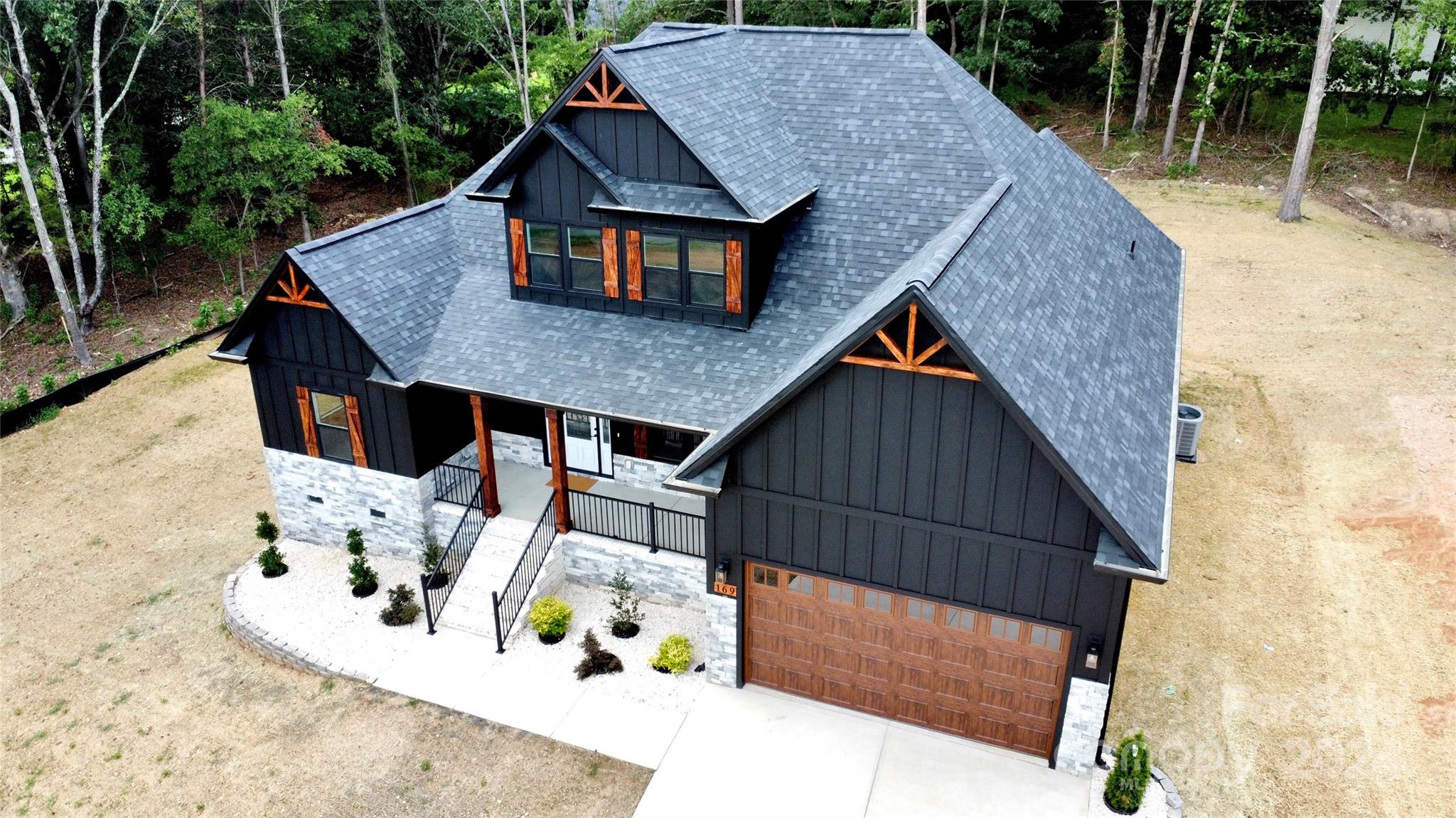 169 Harbor Point Drive Cherryville, NC 28021 - Photo 2 of 37 an aerial view of house with backyard space and seating area