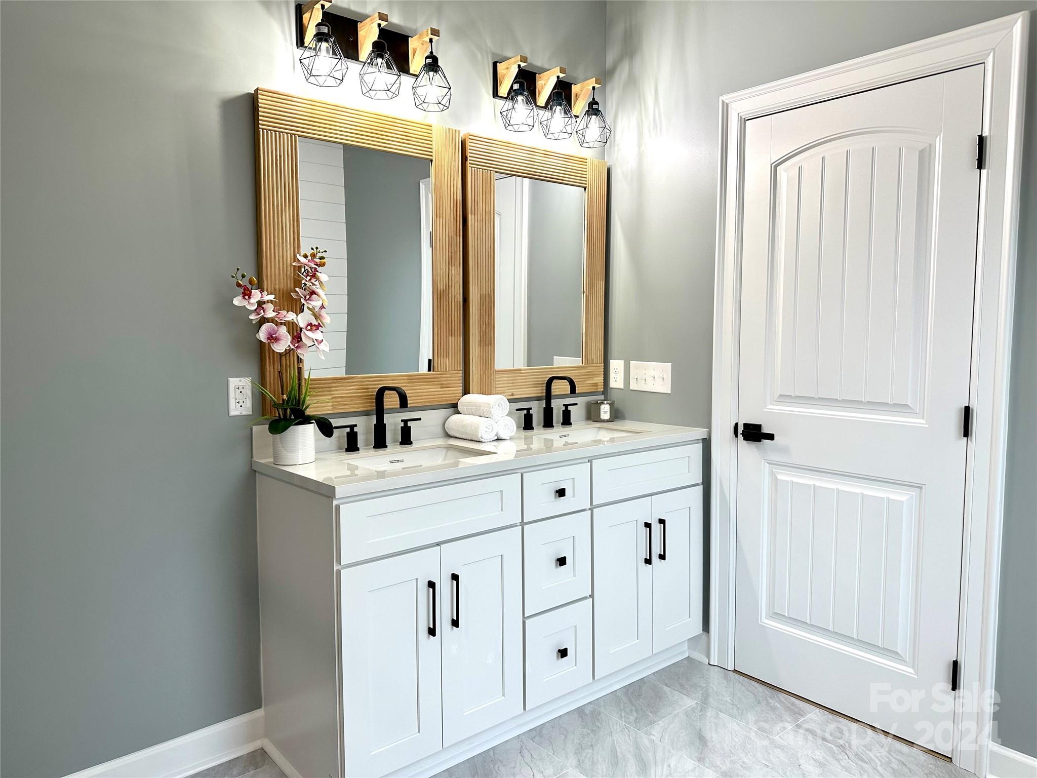 169 Harbor Point Drive Cherryville, NC 28021 - Photo 26 of 37 a bathroom with a double vanity sink and a mirror