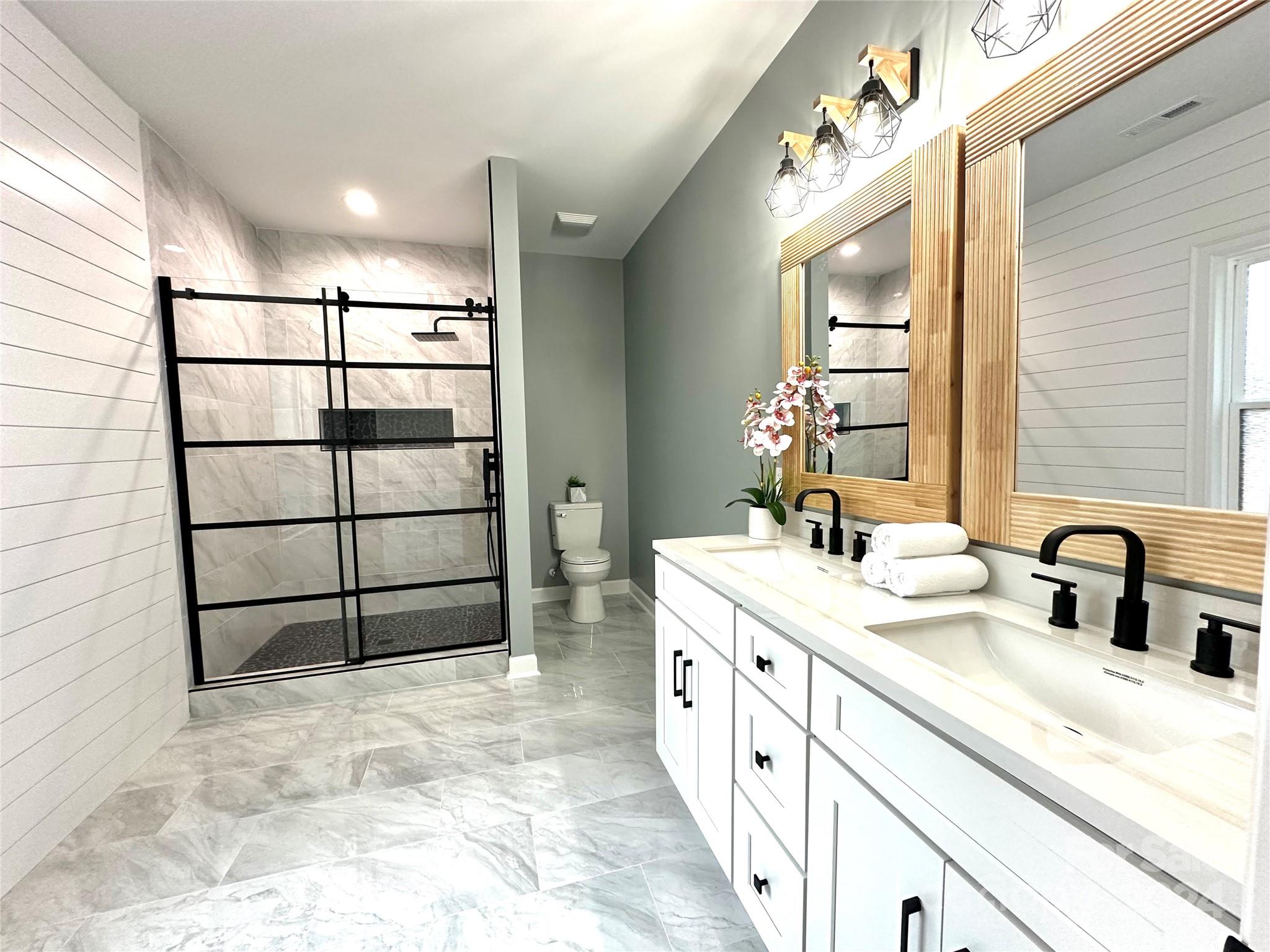 169 Harbor Point Drive Cherryville, NC 28021 - Photo 27 of 37 a bathroom with a sink and a mirror