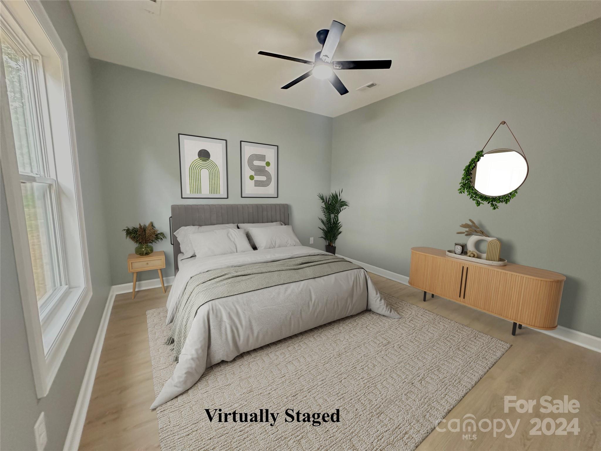 169 Harbor Point Drive Cherryville, NC 28021 - Photo 28 of 37 a bedroom with a large bed and a chandelier