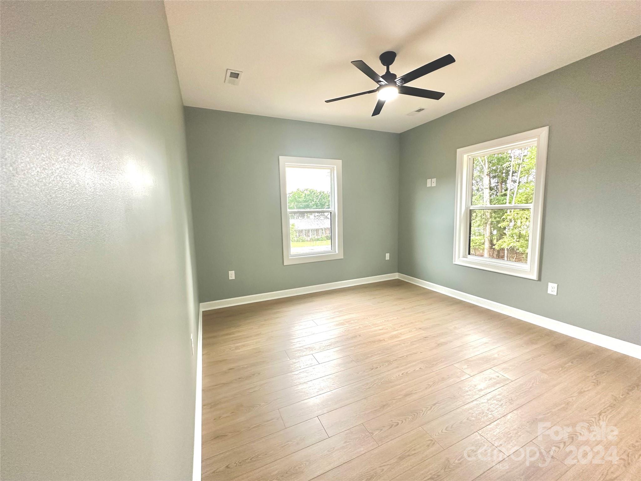 169 Harbor Point Drive Cherryville, NC 28021 - Photo 33 of 37 an empty room with wooden floor and windows