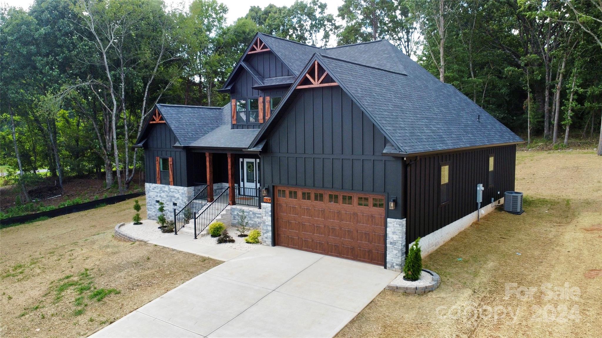 169 Harbor Point Drive Cherryville, NC 28021 - Photo 4 of 37 a front view of a house with a yard