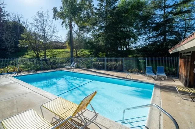 a view of swimming pool with a patio