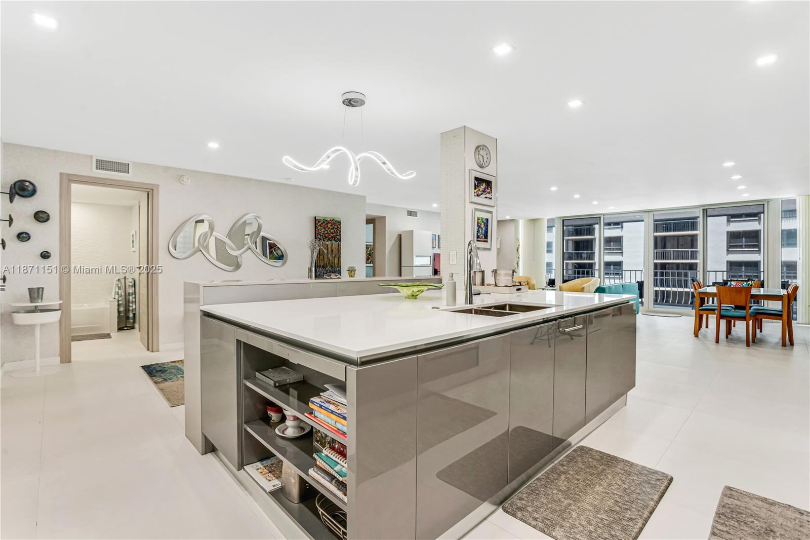 10155 Collins Avenue, Unit 606 Bal Harbour, FL 33154 - Photo 12 of 48 a kitchen with lots of counter top space