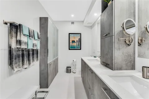 a spacious bedroom with a bed and a large window