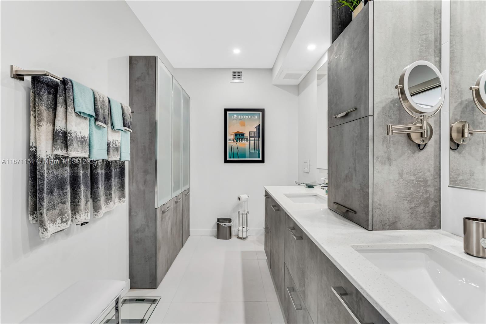 10155 Collins Avenue, Unit 606 Bal Harbour, FL 33154 - Photo 21 of 48 a bathroom with a tub sink and mirror