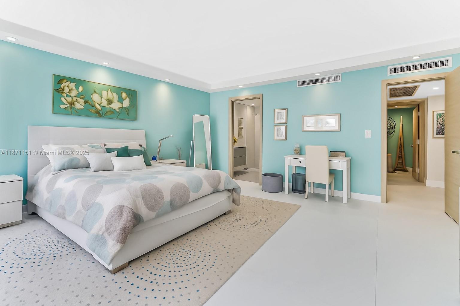 10155 Collins Avenue, Unit 606 Bal Harbour, FL 33154 - Photo 24 of 48 a bedroom with a bed and chair