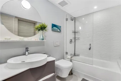 a room with lots of furniture and white walls