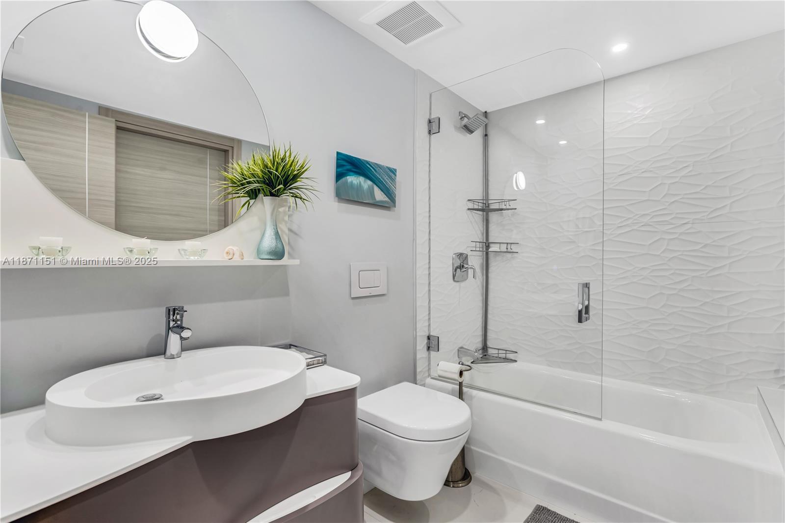 10155 Collins Avenue, Unit 606 Bal Harbour, FL 33154 - Photo 30 of 48 a bathroom with a sink toilet and shower