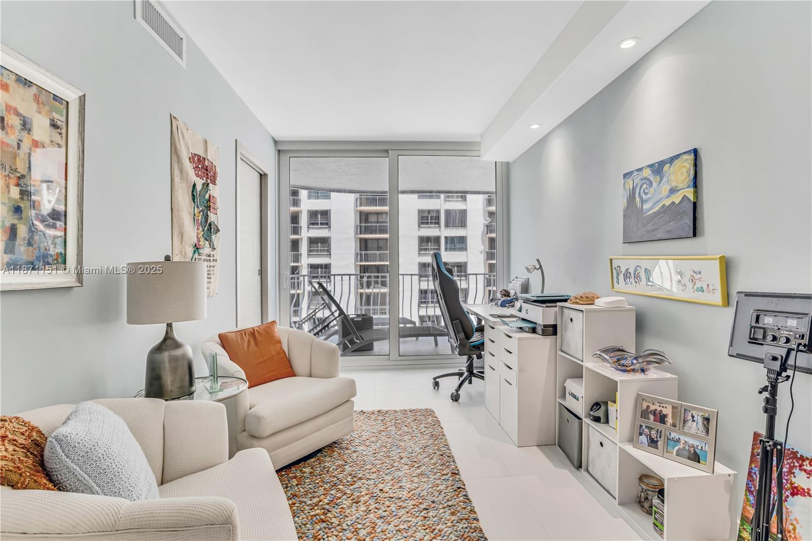 10155 Collins Avenue, Unit 606 Bal Harbour, FL 33154 - Photo 31 of 48 a living room with furniture and a large window