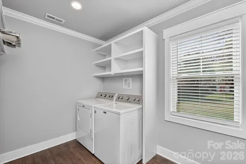 a view of cabinets with washer and dryer