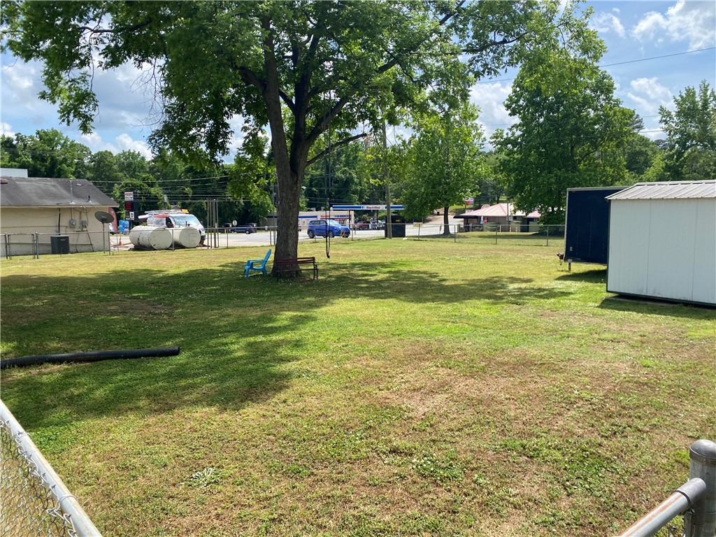 3 Heyward Avenue Honea Path, SC 29654 - Photo 28 of 35 This spacious yard offers ample green space and a chain-link fence for privacy and security.