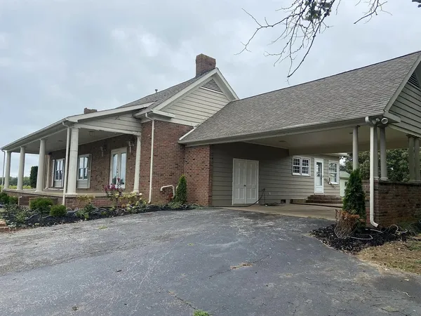 a front view of a house with yard