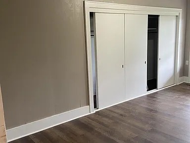 11495 Guthrie Road Guthrie, KY 42234 - Photo 3 of 7 a view of an empty room with wooden floor