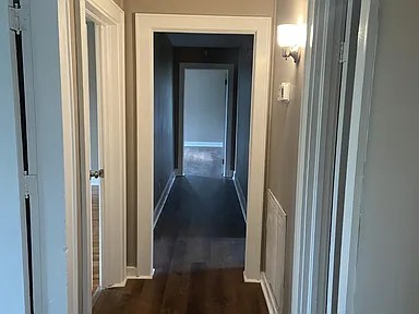 11495 Guthrie Road Guthrie, KY 42234 - Photo 4 of 7 a view of a hallway with a wooden door