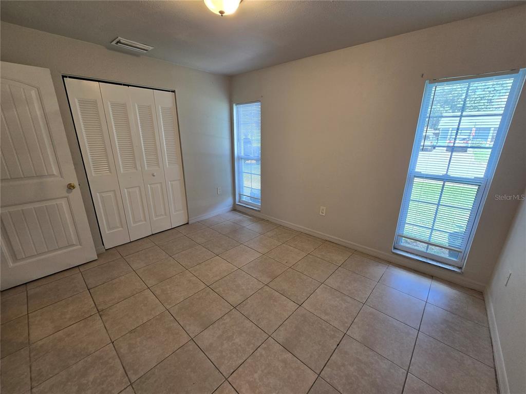 3406 Murrow Street New Port Richey, FL 34655 - Photo 5 of 21 an empty room with windows