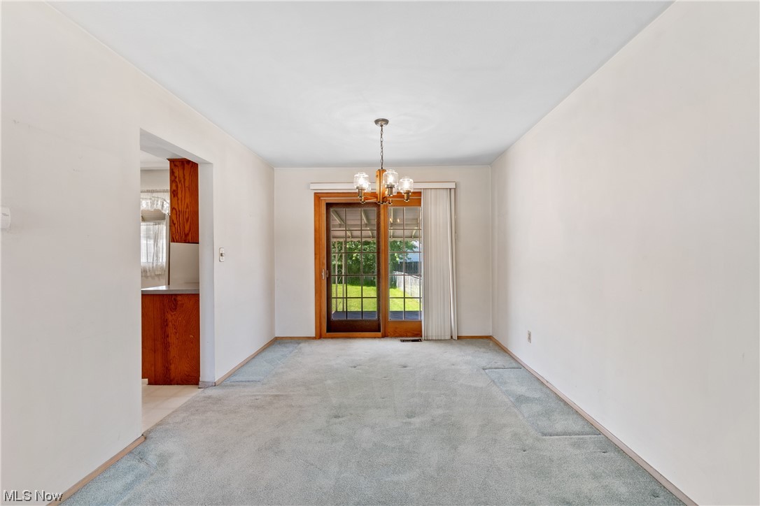 1722 Chelmsford Road Cleveland, OH 44124 - Photo 6 of 34 View of carpeted empty room
