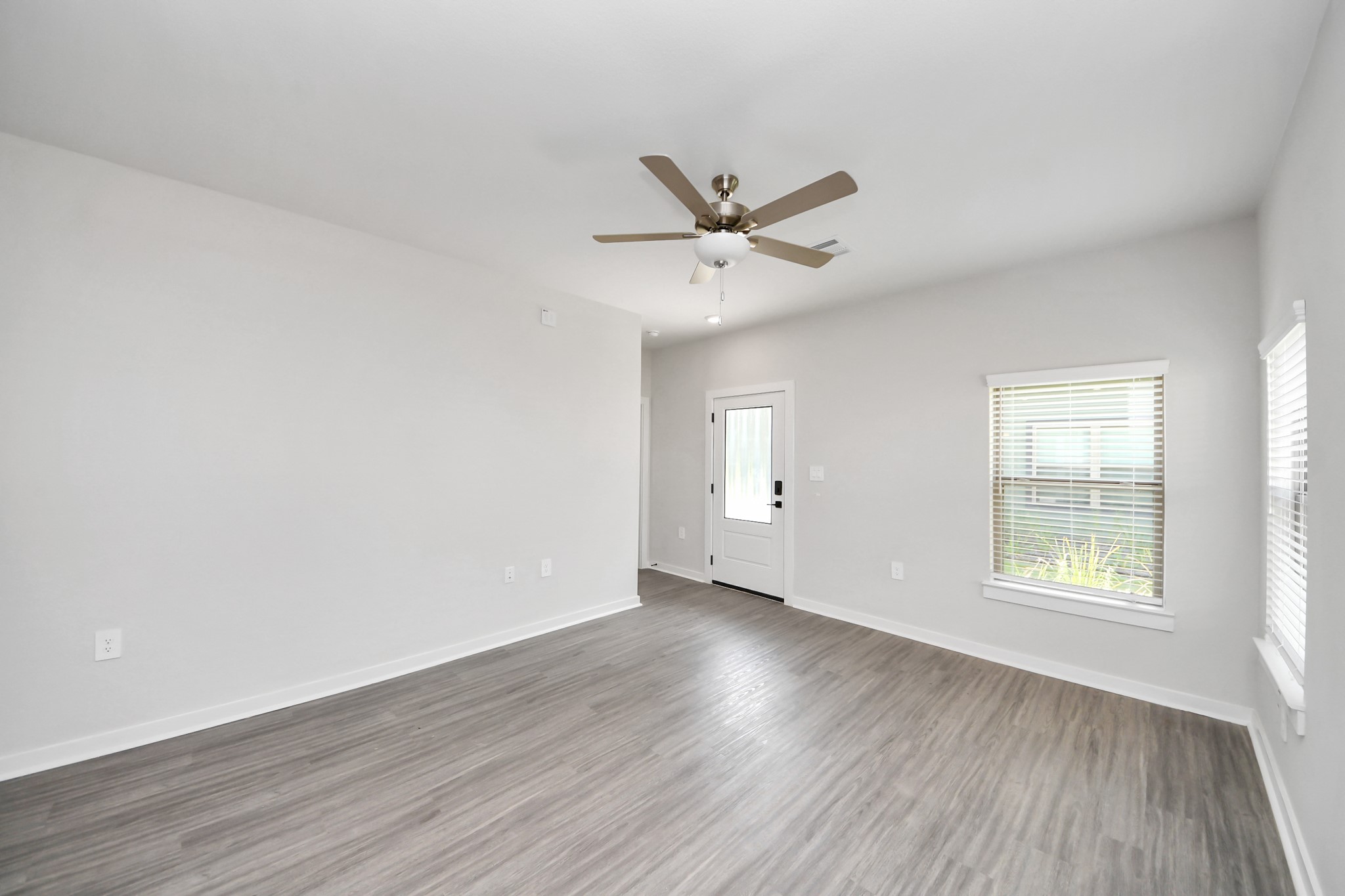 7711 Longmire Road, Unit 5 Conroe, TX 77304 - Photo 45 of 48 Open Concept Floor Plan with wood-like floors throughout!