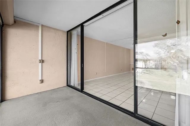 a view of a swimming pool with an outdoor space and seating area