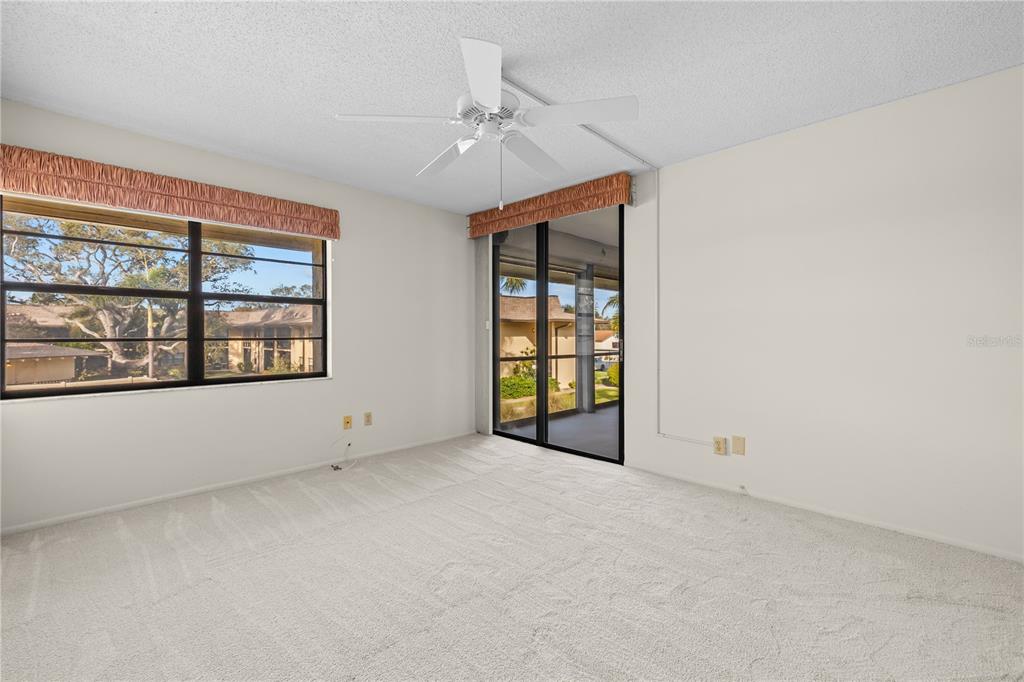 12300 Vonn Road, Unit 1205 Largo, FL 33774 - Photo 17 of 32 an empty room with windows