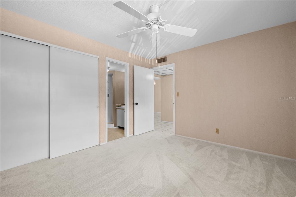 12300 Vonn Road, Unit 1205 Largo, FL 33774 - Photo 24 of 32 a view of a chandelier fan and entryway