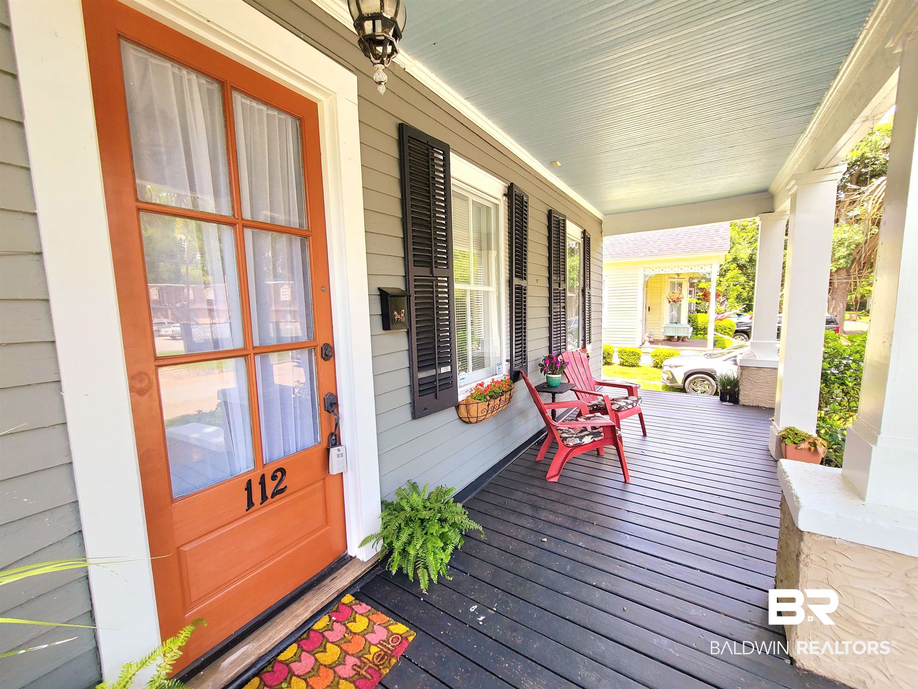 112 Espejo Street Mobile, AL 36604 - Photo 2 of 20 Wooden terrace featuring a porch