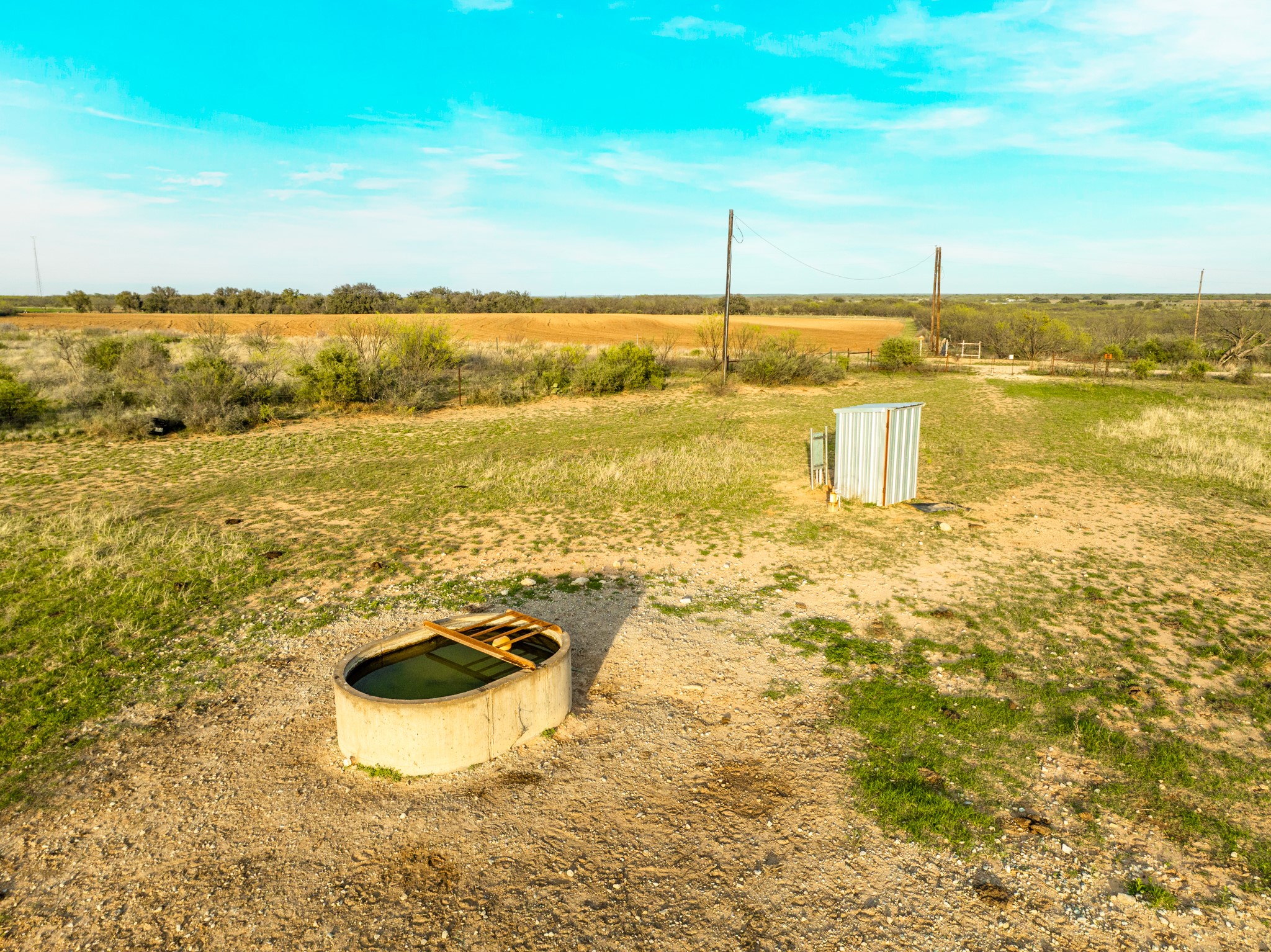 2145 County Road 320 Lohn, TX 76852 - Photo 26 of 39 Entry to storm shelter featuring a view of countryside