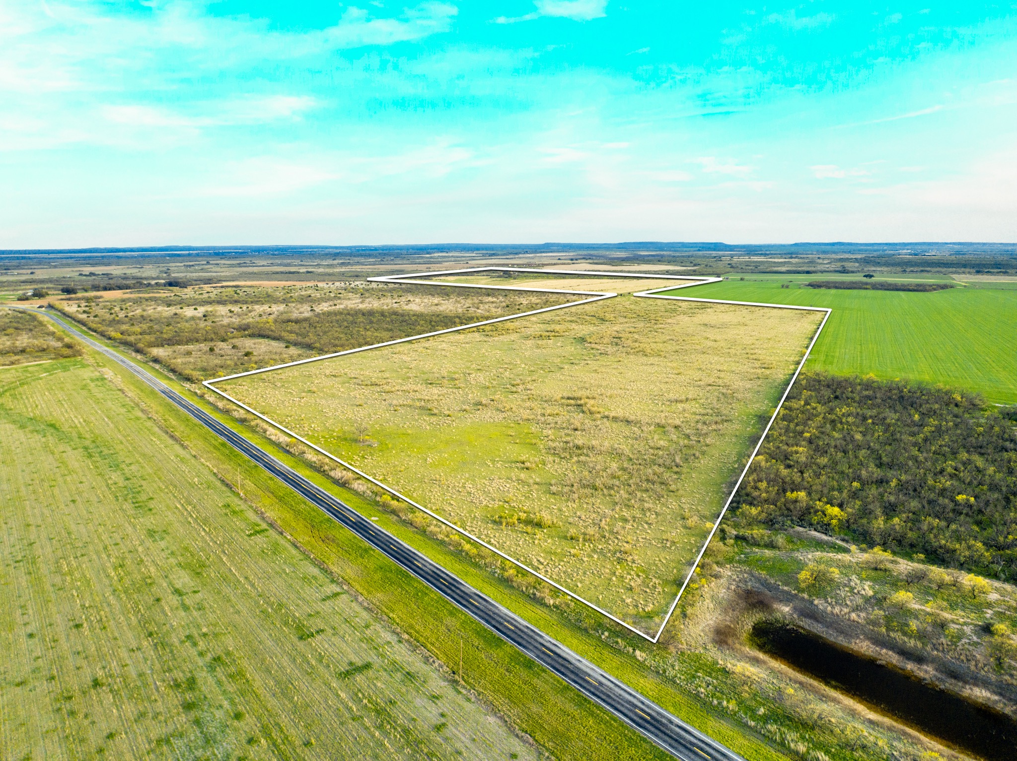 2145 County Road 320 Lohn, TX 76852 - Photo 30 of 39 Aerial view of sparsely populated area featuring property parcel outlined and farmland