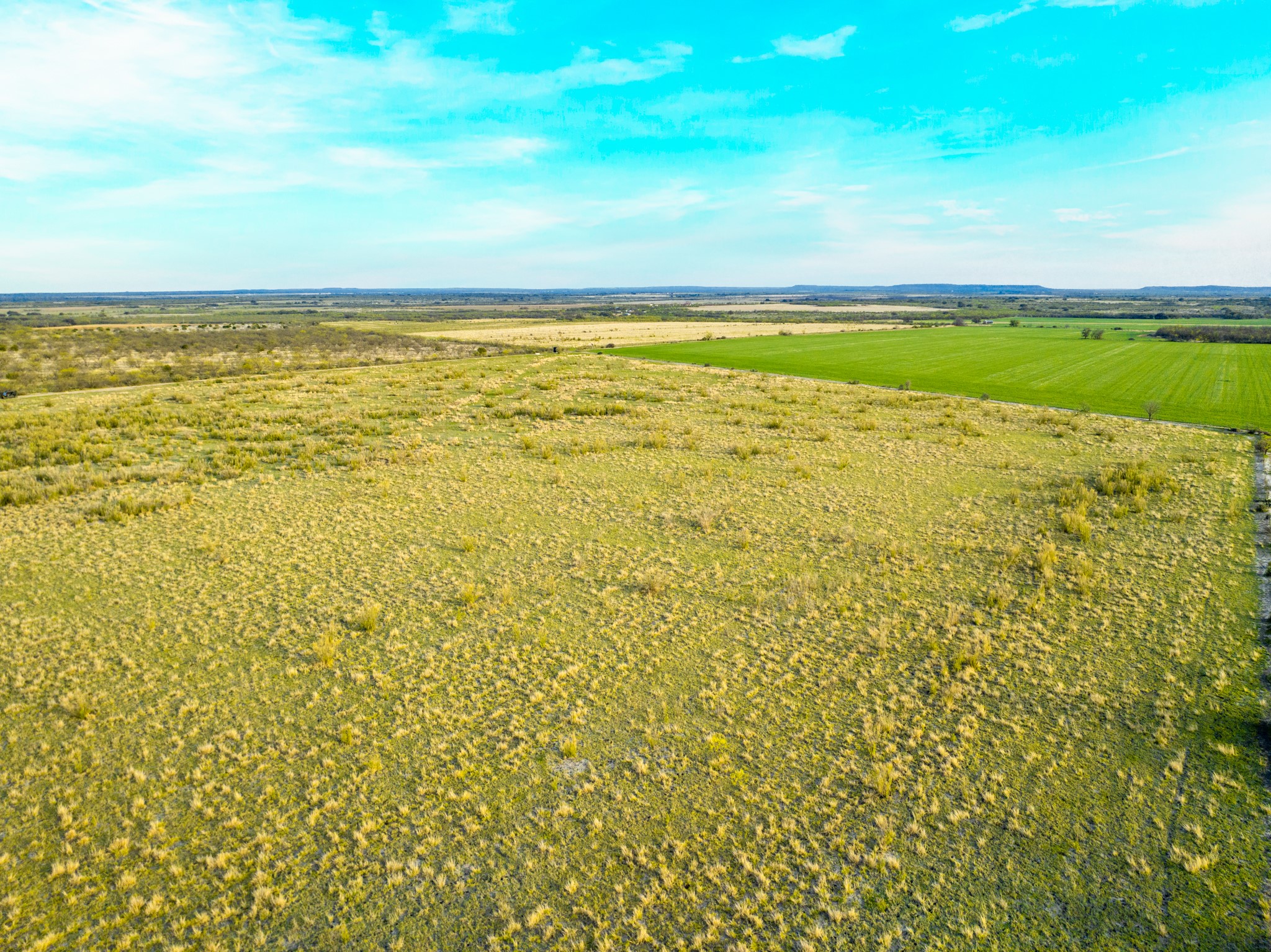 2145 County Road 320 Lohn, TX 76852 - Photo 33 of 39 Aerial view of sparsely populated area featuring large plots for crops