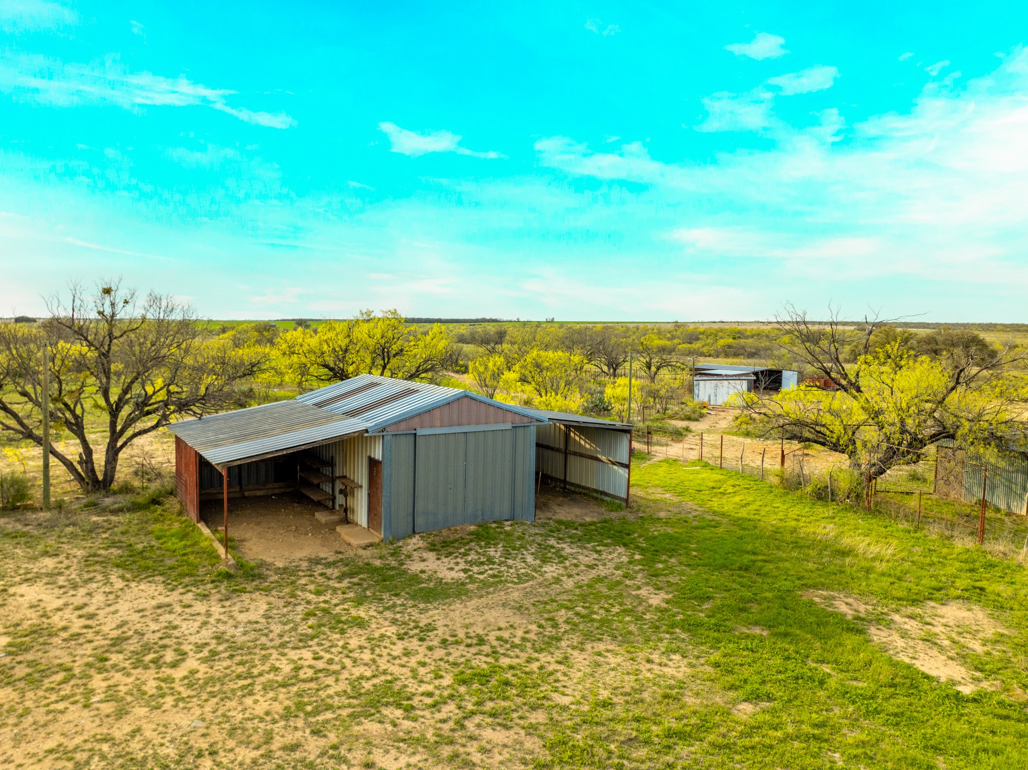 2145 County Road 320 Lohn, TX 76852 - Photo 5 of 39 View of yard with an outbuilding and a view of countryside