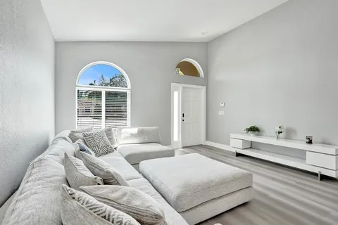 a kitchen with a sink stove and microwave