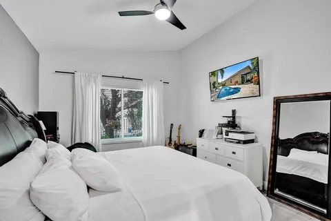 a bathroom with a sink mirror and vanity