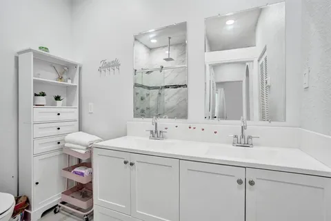 a view of a patio with a table and chairs