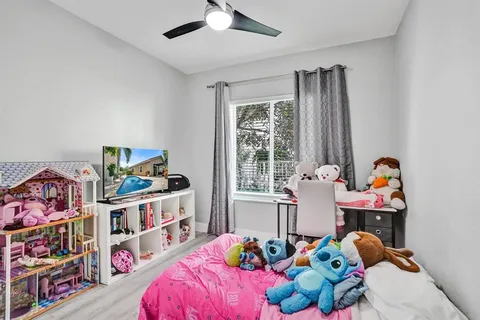 a view of a house with backyard fire pit and patio