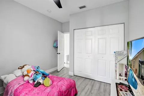 a view of backyard with outdoor seating and plants