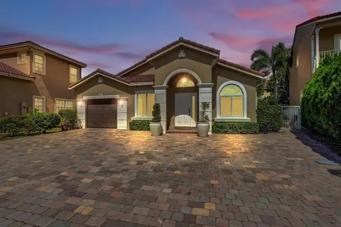 a view of a backyard with plants and a potted plants