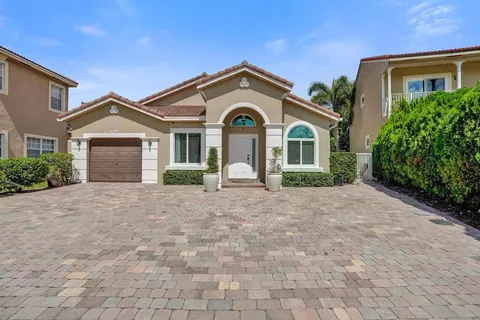 a view of a backyard with potted plants