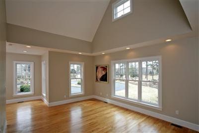 304 Parker Road Osterville, MA 02655 - Photo 13 of 15 a view of an empty room with wooden floor and a window